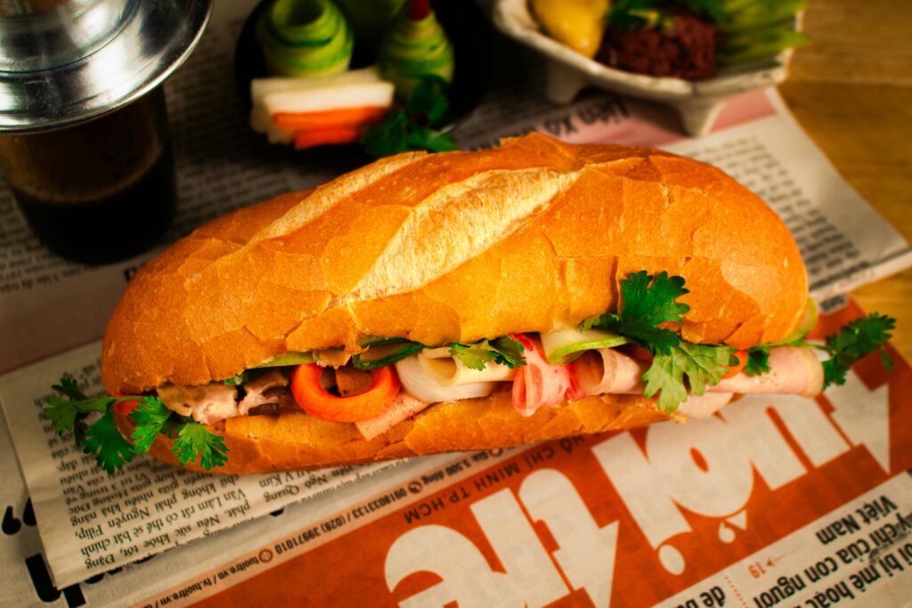 Mouth-watering bánh mì sandwich with fresh ingredients, perfect for food lovers.